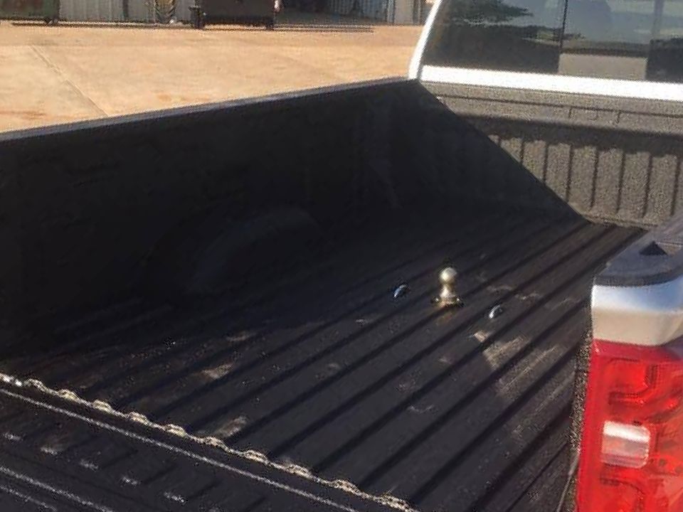 photo of truck bed with spray on bed liner installed
