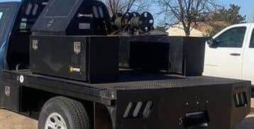 photo of black tool boxes on black flatbed truck