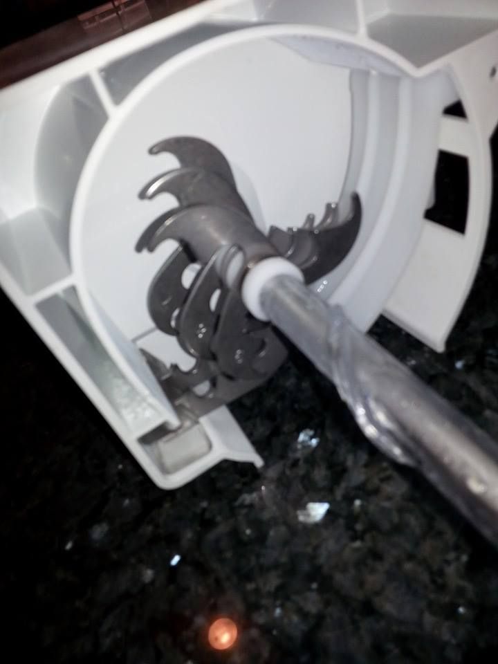 A close up of a blender with a metal handle