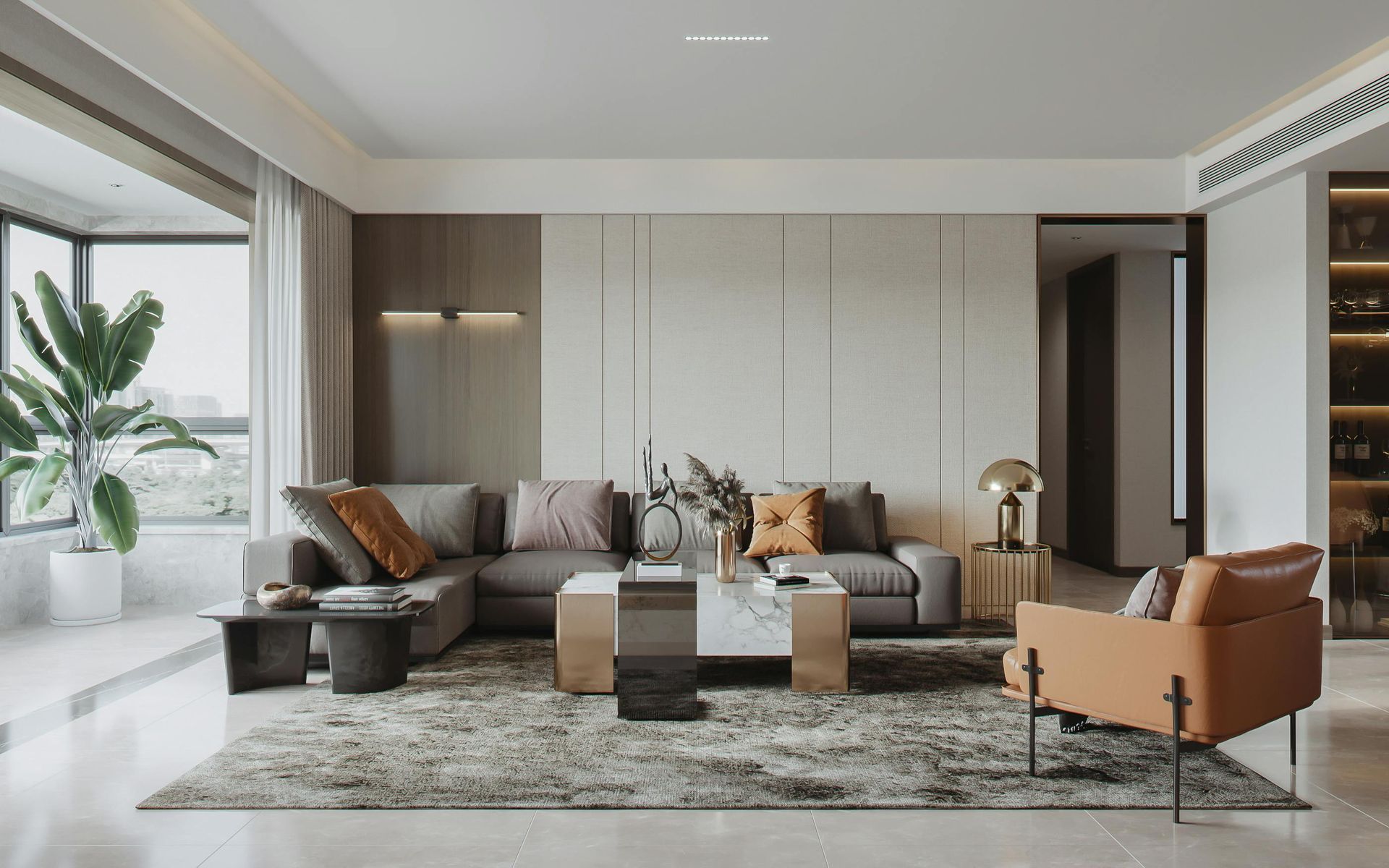 Modern living room with gray sectional sofa, tan chair, and marble coffee table.