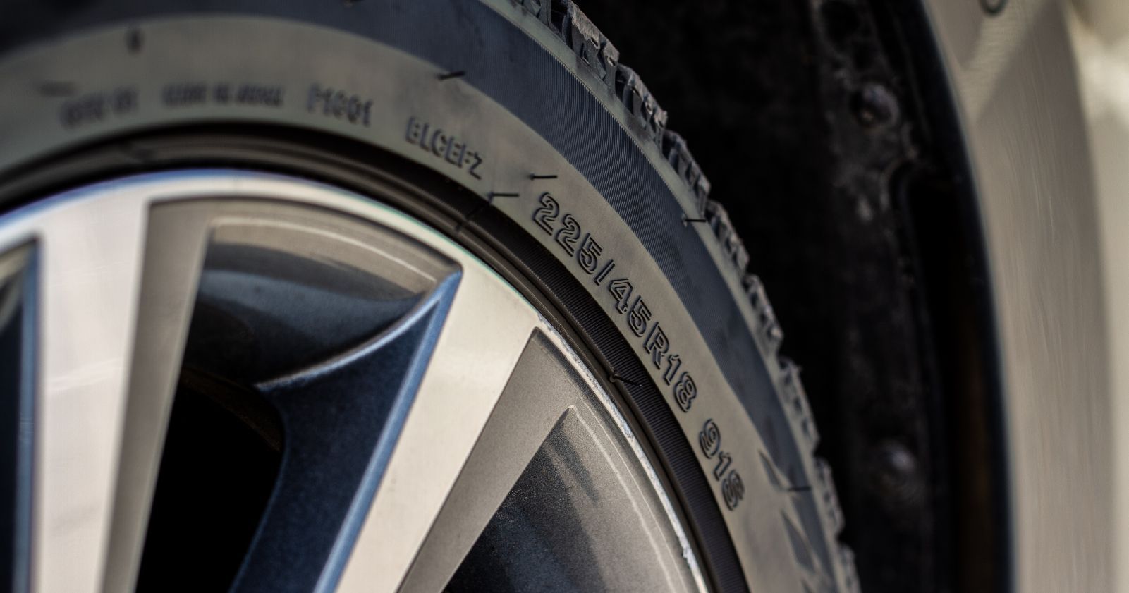 a close up of a tire on a car wheel to accompany a tire sizing article