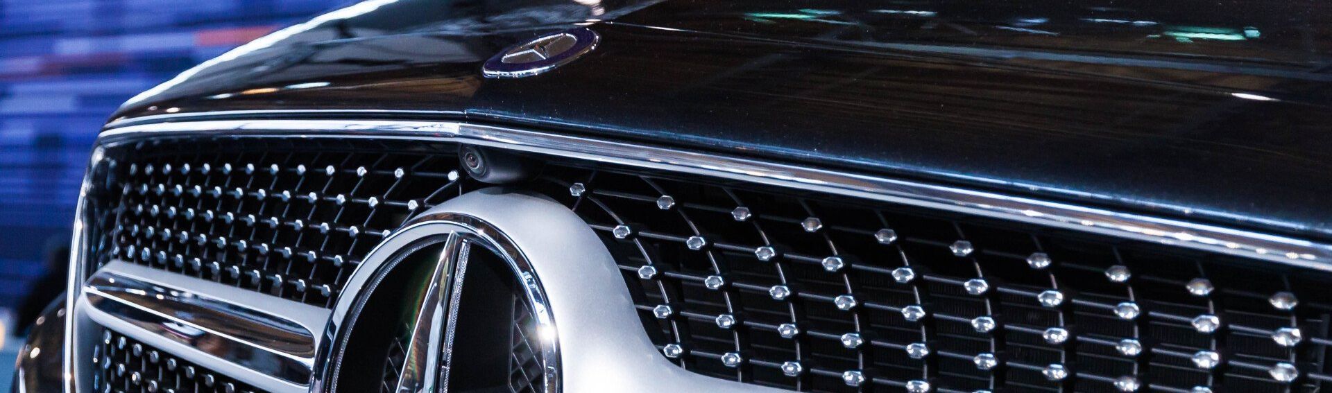 a close up of the front of a mercedes benz car