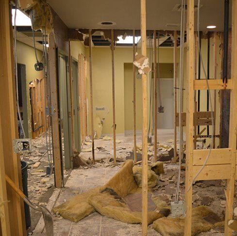 A room that is being remodeled with a lot of wood