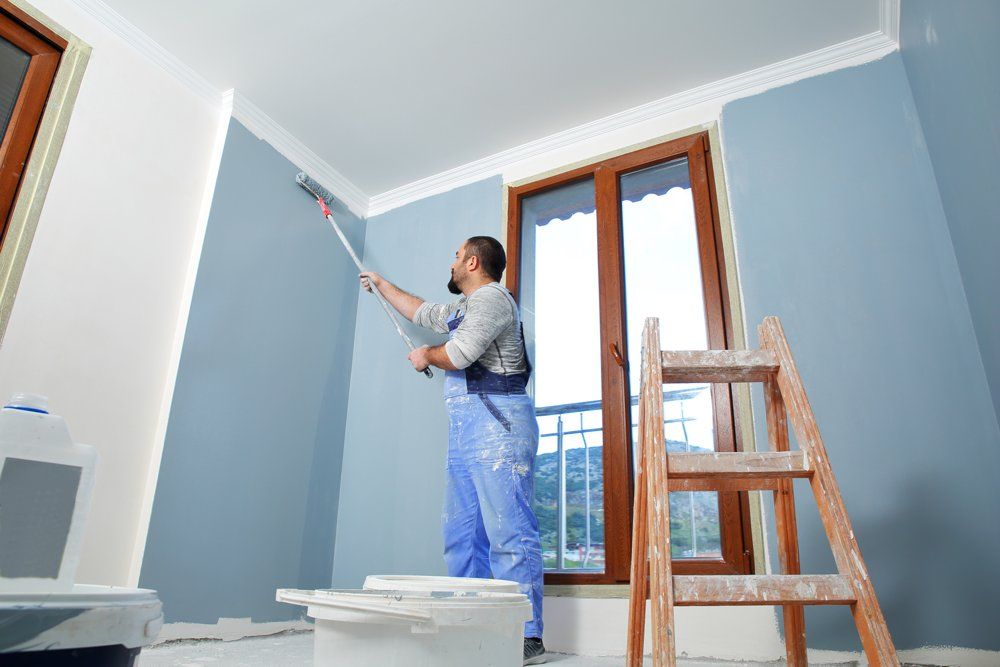 Man Doing House Interior Painting — Pensacola, FL — Protected Painting Services