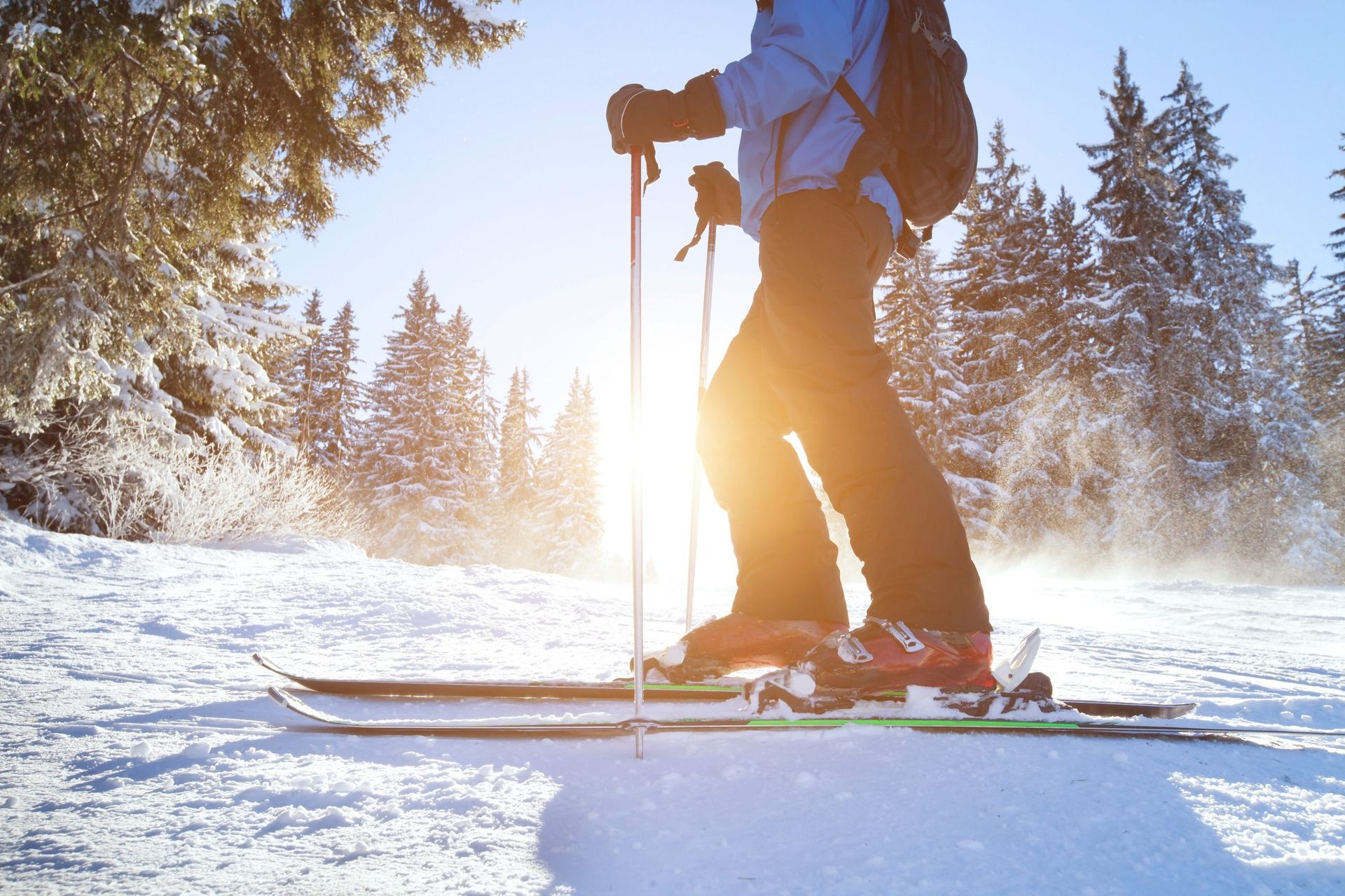 A person is skiing down a snow covered slope.