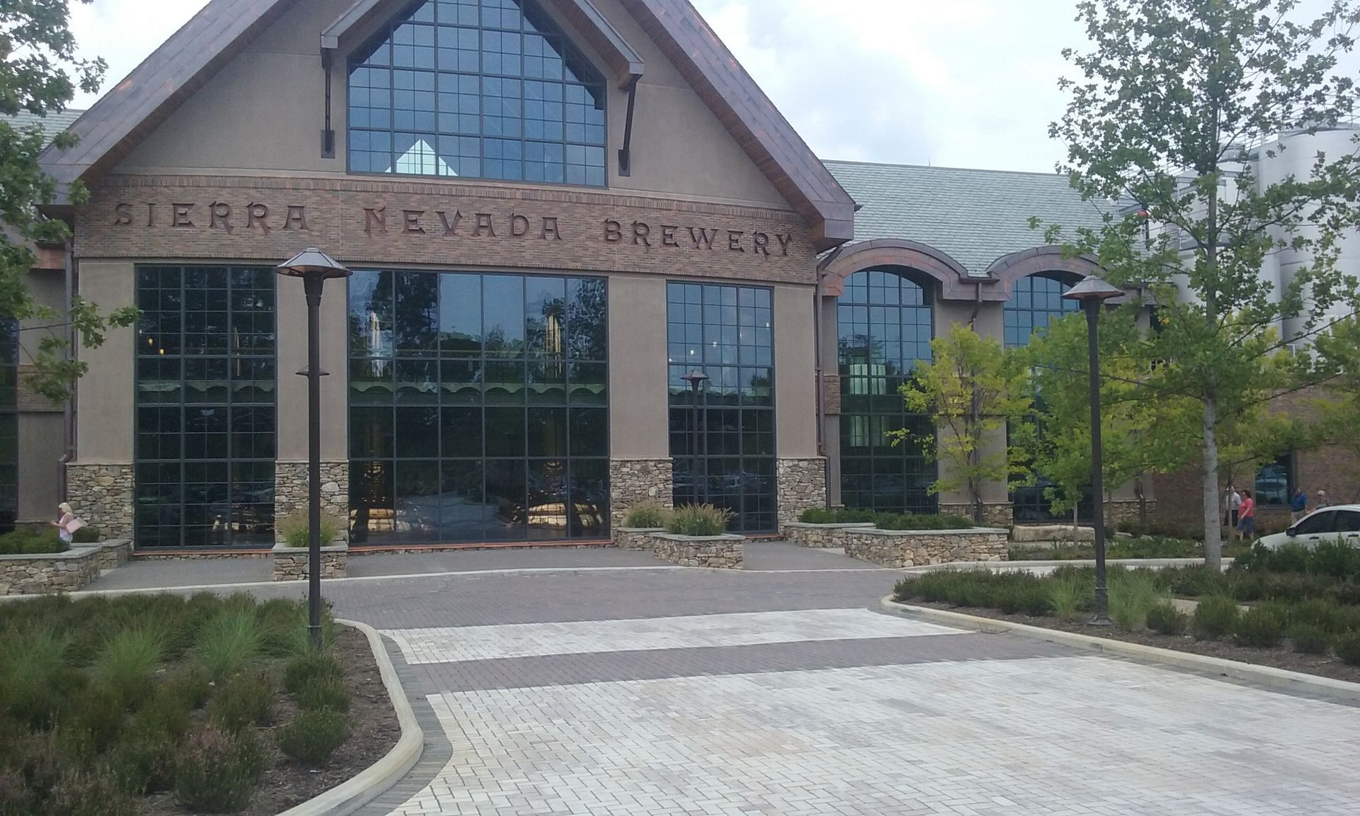 Sierra Nevada Brewery building with large glass windows and stone accents.