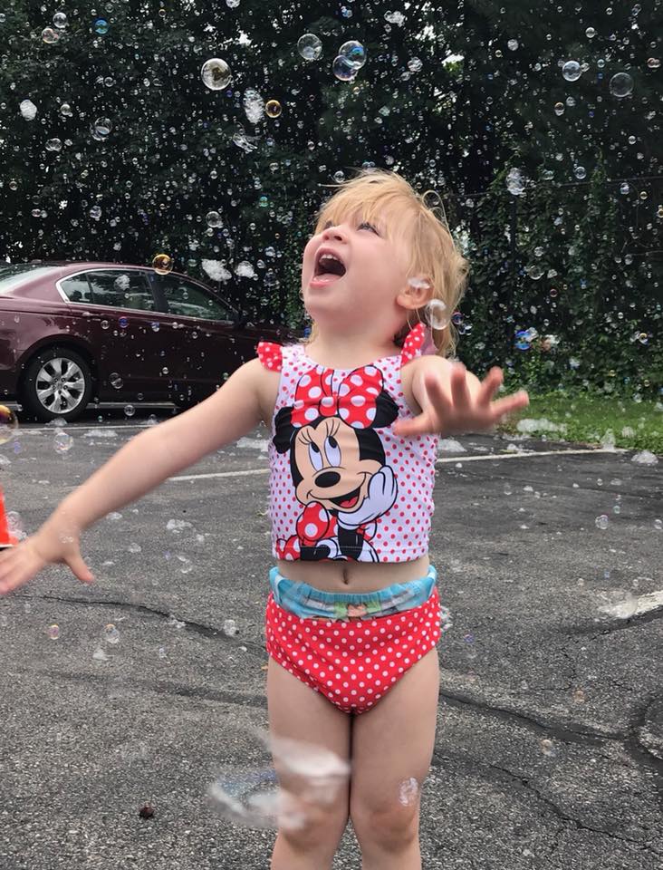Little Girl Enjoying the Bubbles — Wappinger Falls, NY — Raising the Standard for Child Care Services