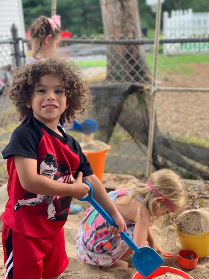 Curly Boy with the Shovel — Wappinger Falls, NY — Raising the Standard for Child Care Services