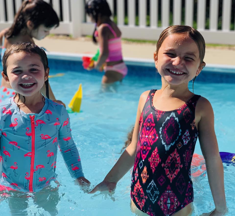 Girls Smiling While Holding Hands — Wappinger Falls, NY — Raising the Standard for Child Care Services