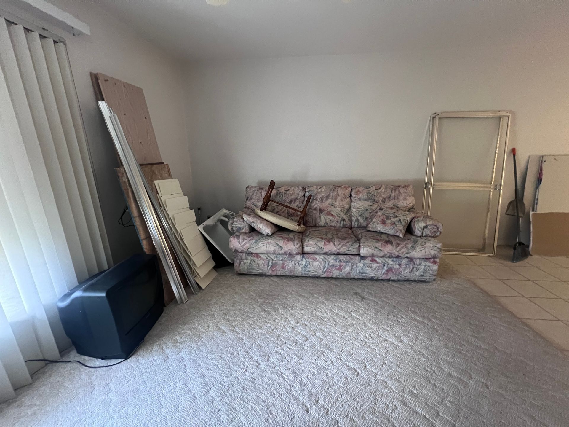 A living room with a couch and a television