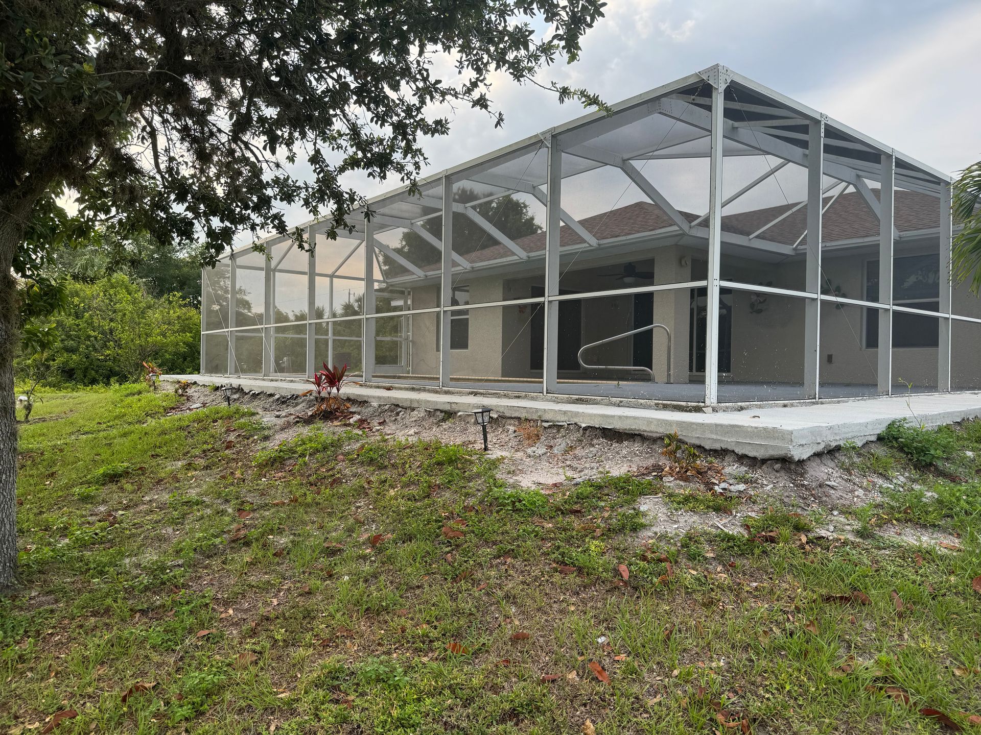 A house is being built with a screened in porch.