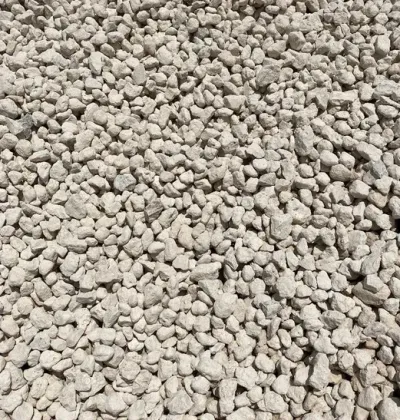 A pile of white gravel is sitting on the ground.