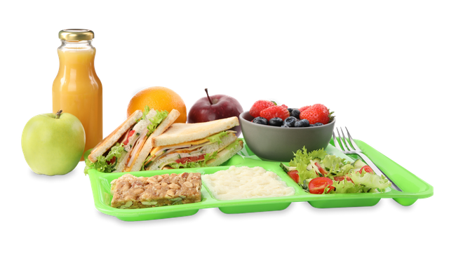 A green tray filled with sandwiches , fruit , and juice.
