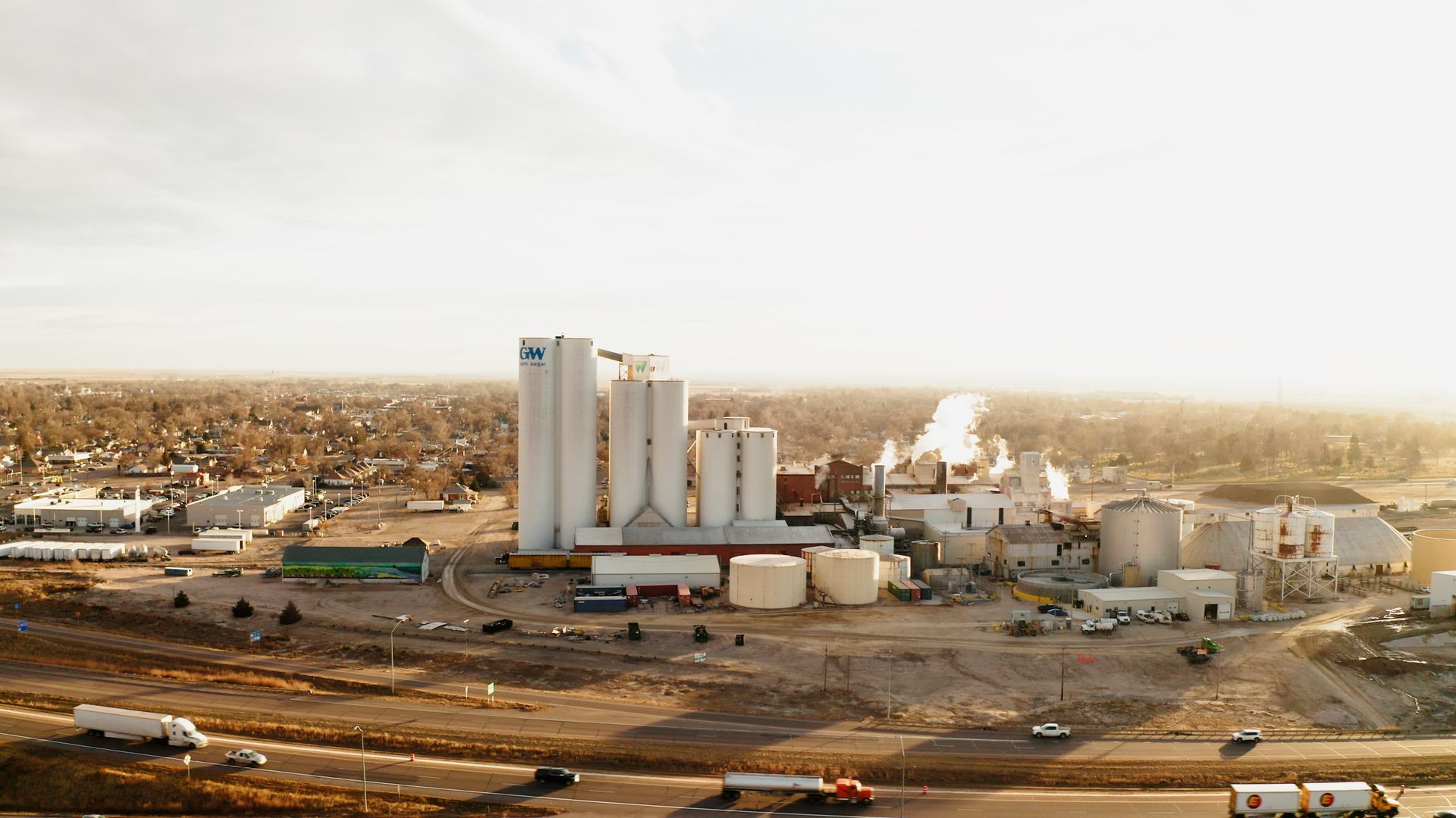 An aerial view of a factory in the middle of a desert.