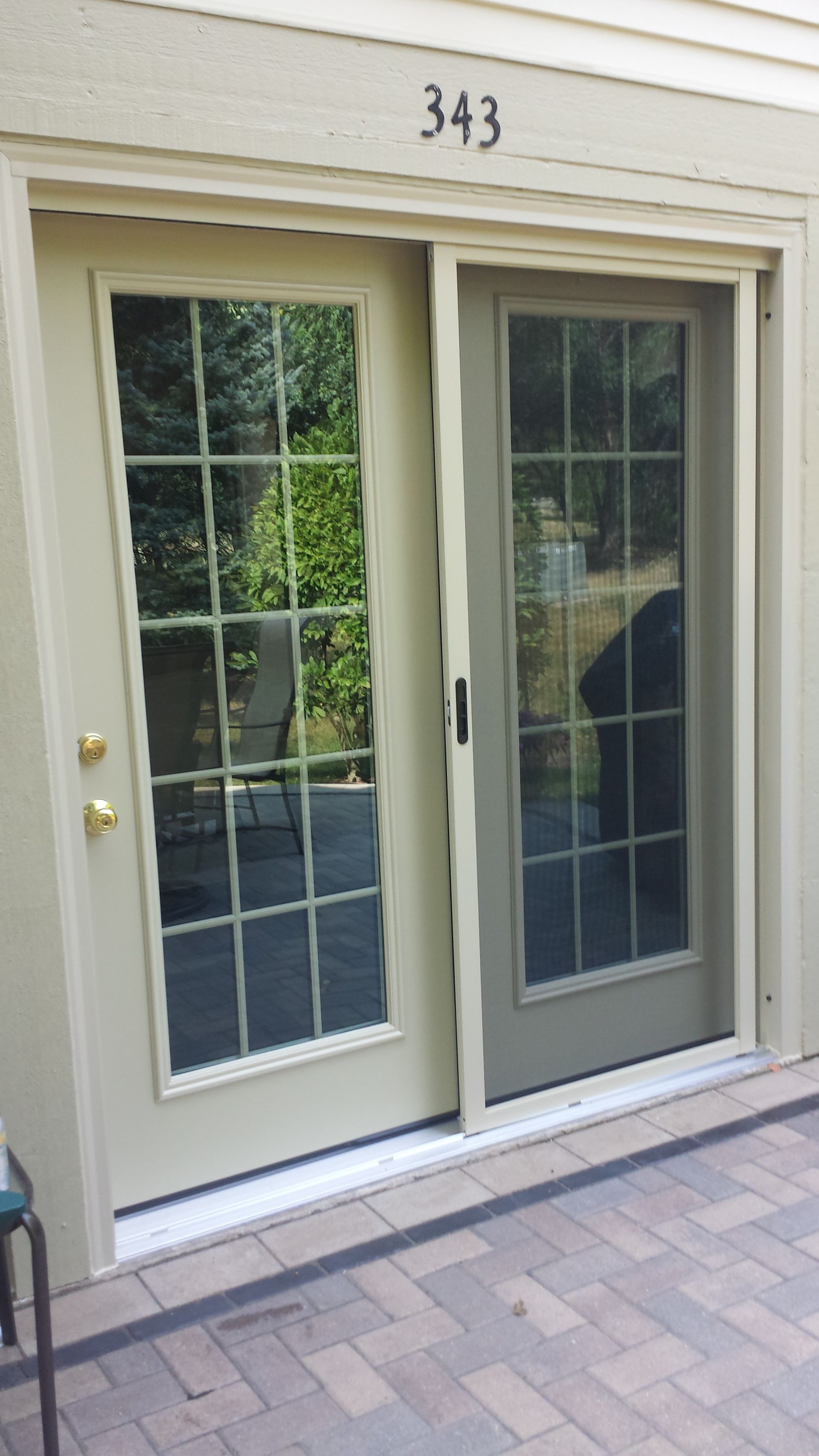 A sliding glass door with the number 343 on it