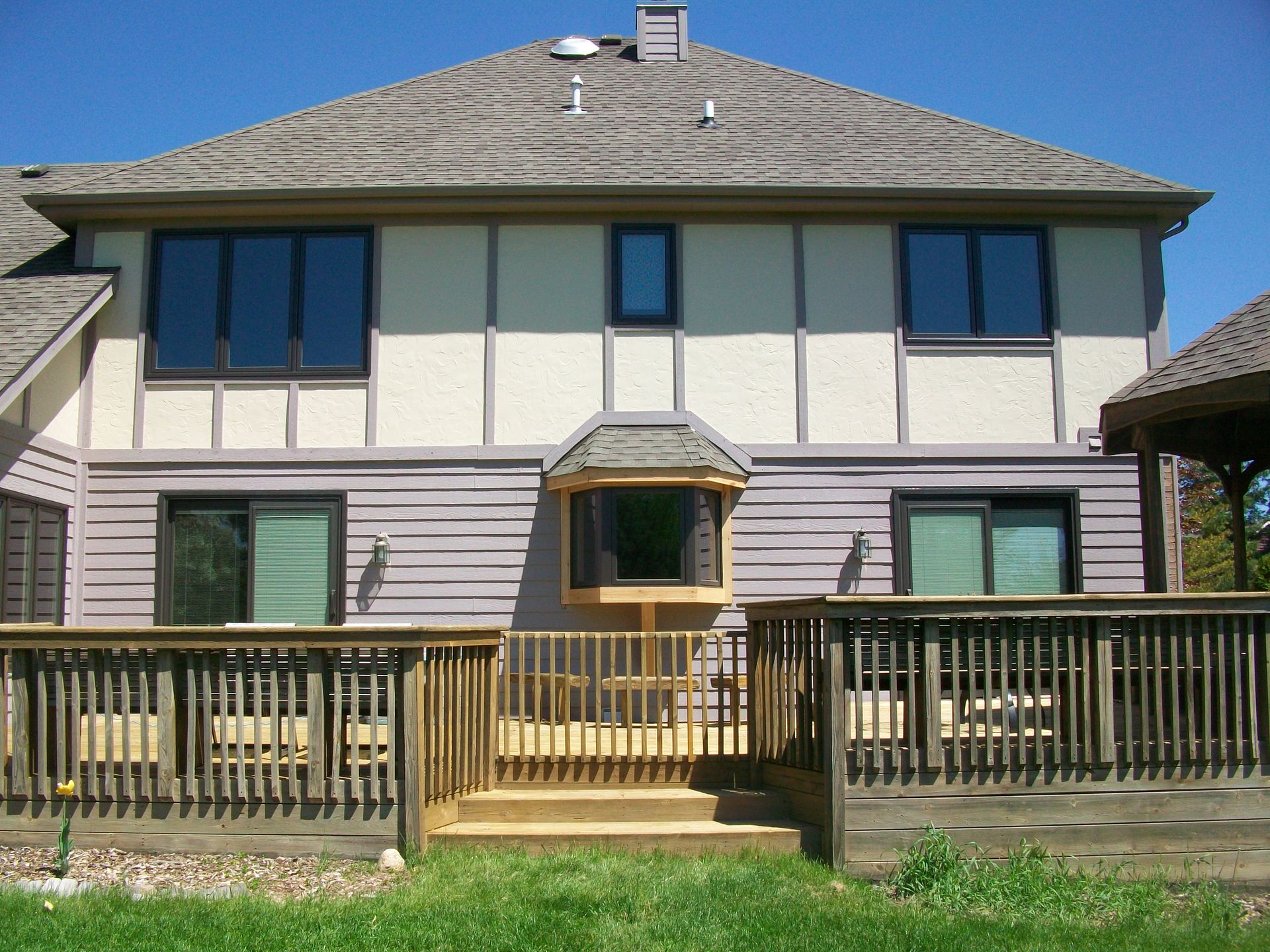 The back of a house with a deck and stairs