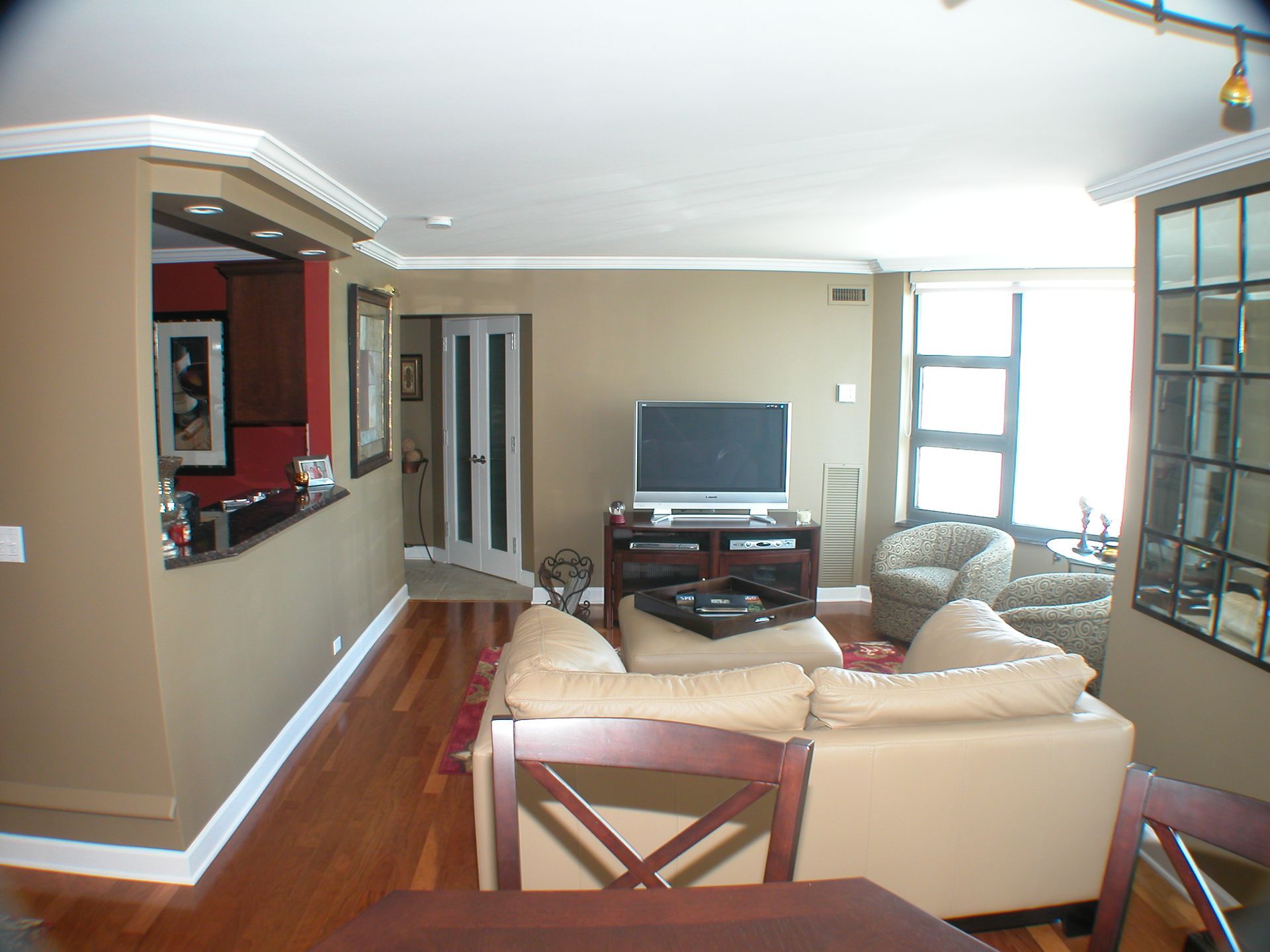 A living room with a couch and a flat screen tv
