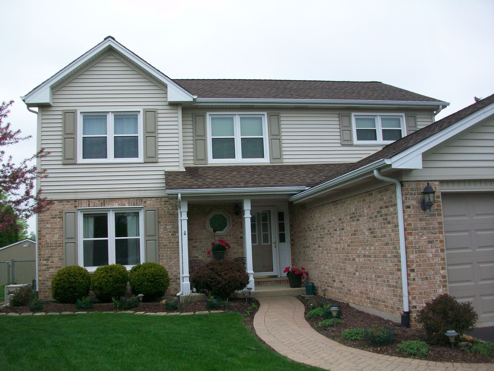 A house with a walkway leading to the front door