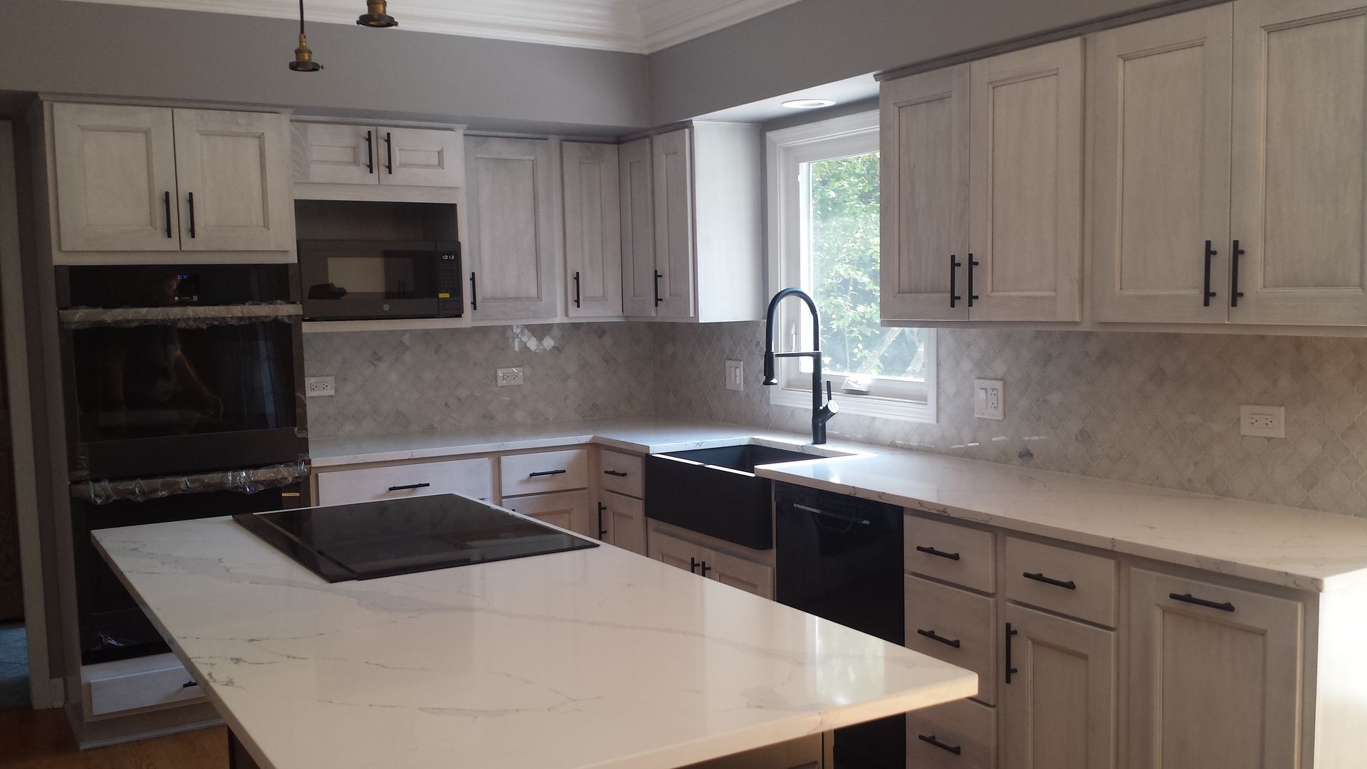 There is a large island in the middle of the kitchen.