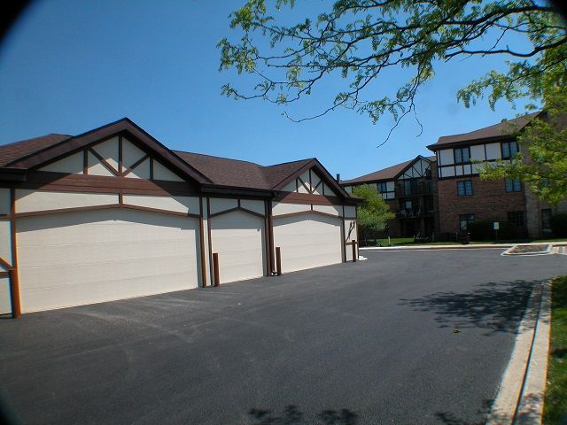 A row of garages in front of a building