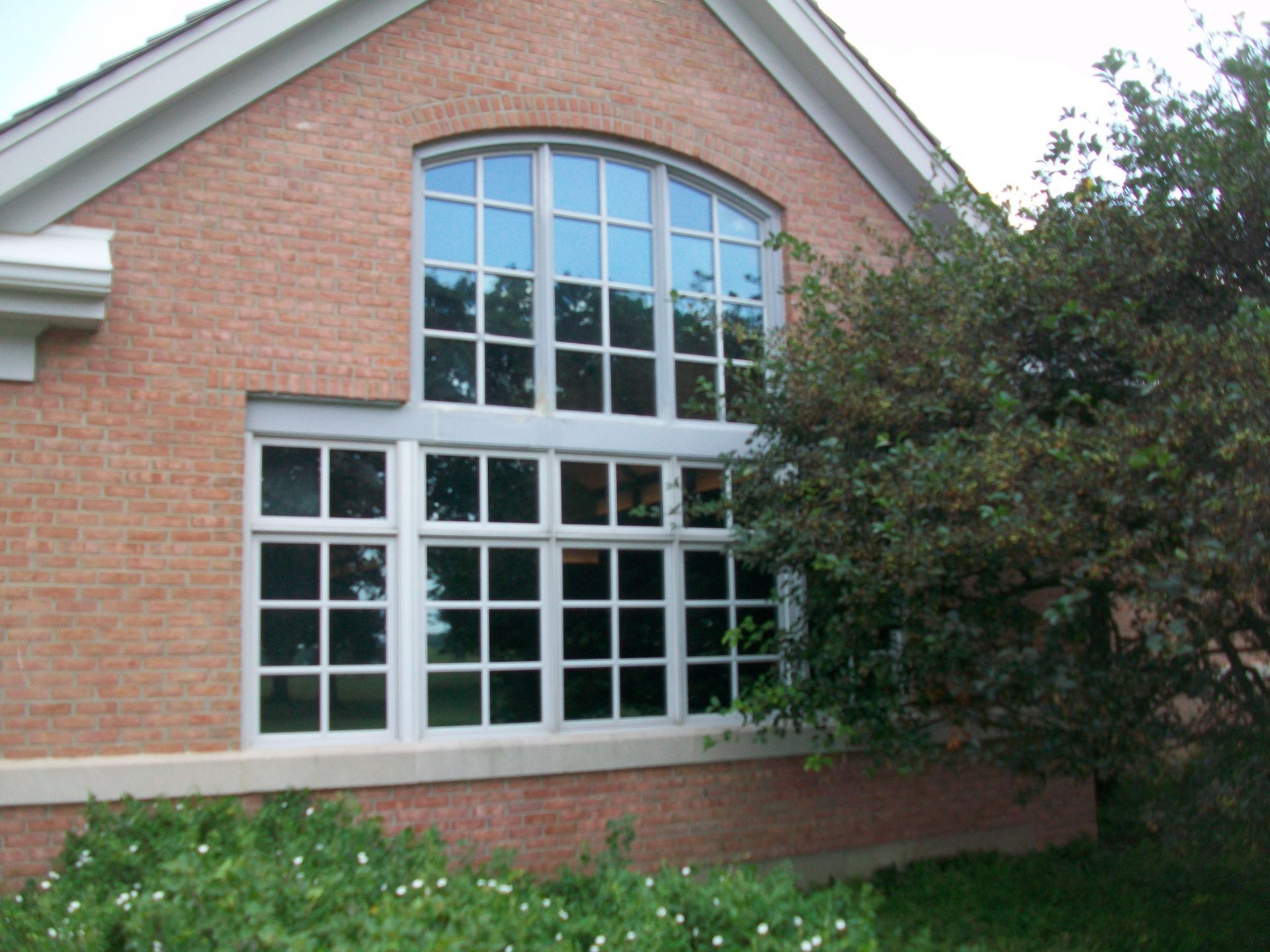 A brick building with a large window on the side