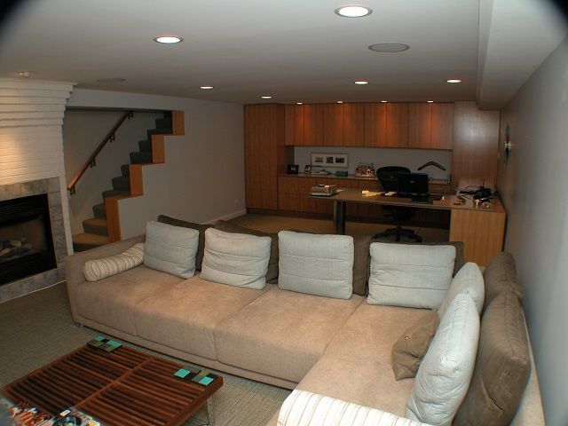 A living room with a couch and a fireplace