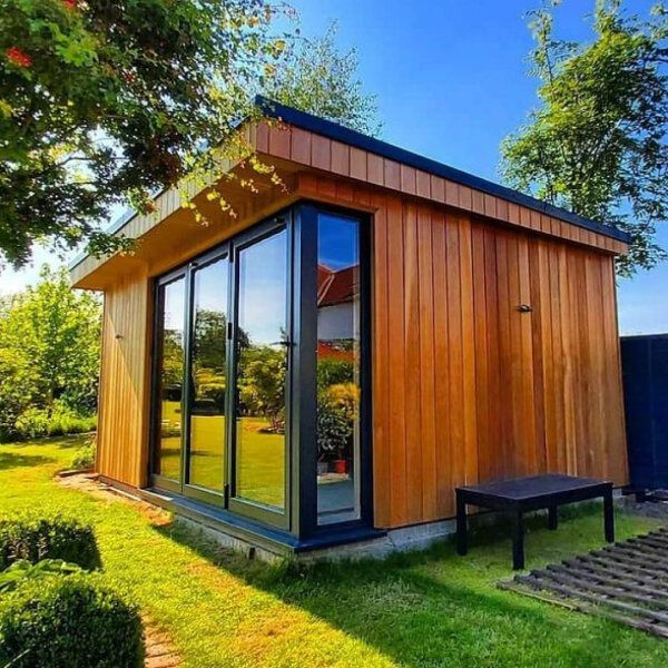 Lovely modern brown garden shed in a Swansea garden, expertly painted by Daffodil Decor.