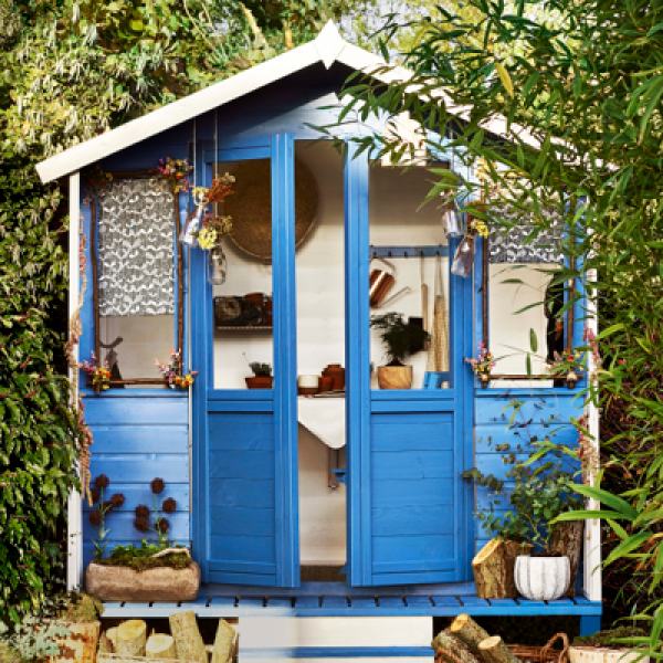 Lovely blue garden shed in a Swansea garden, expertly painted by Daffodil Decor.