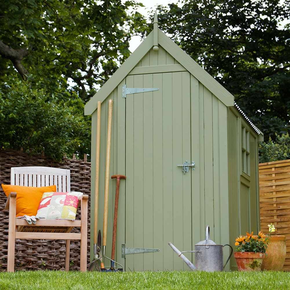 Lovely green garden shed in a Swansea garden, expertly painted by Daffodil Decor.