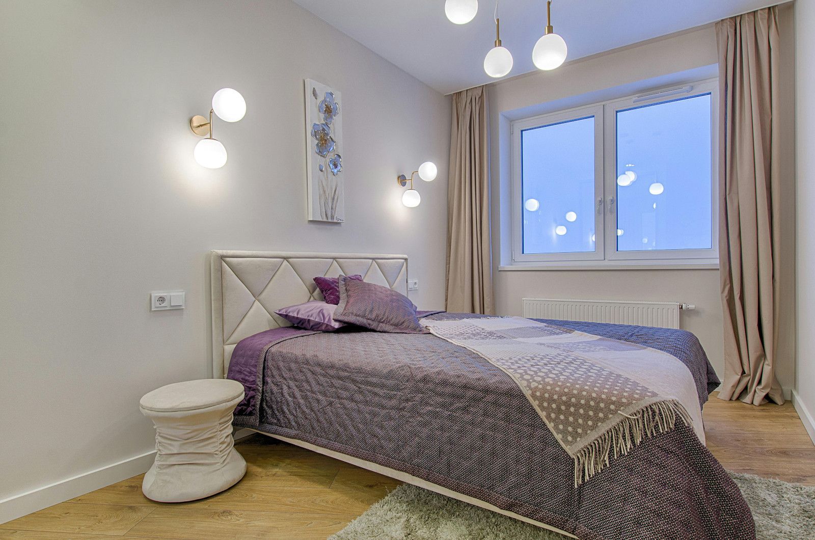 A bedroom with a bed , nightstand , and window.