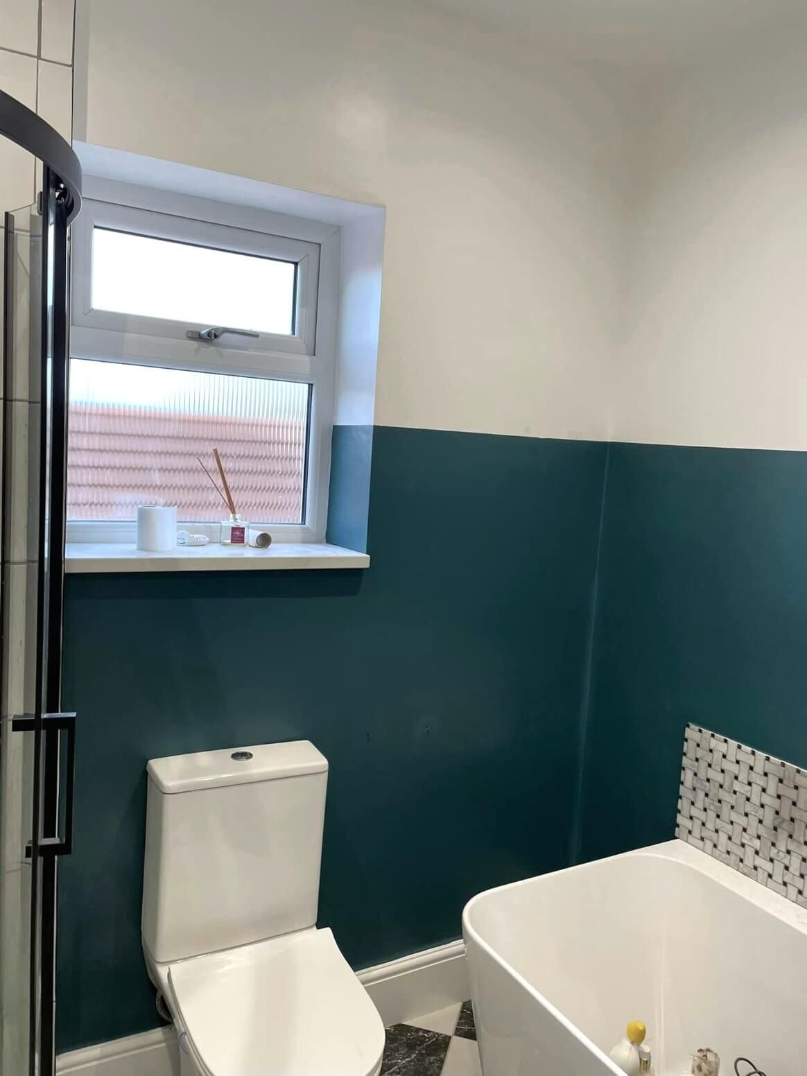 Swansea bathroom with white and blue walls painted by Daffodil Decor.