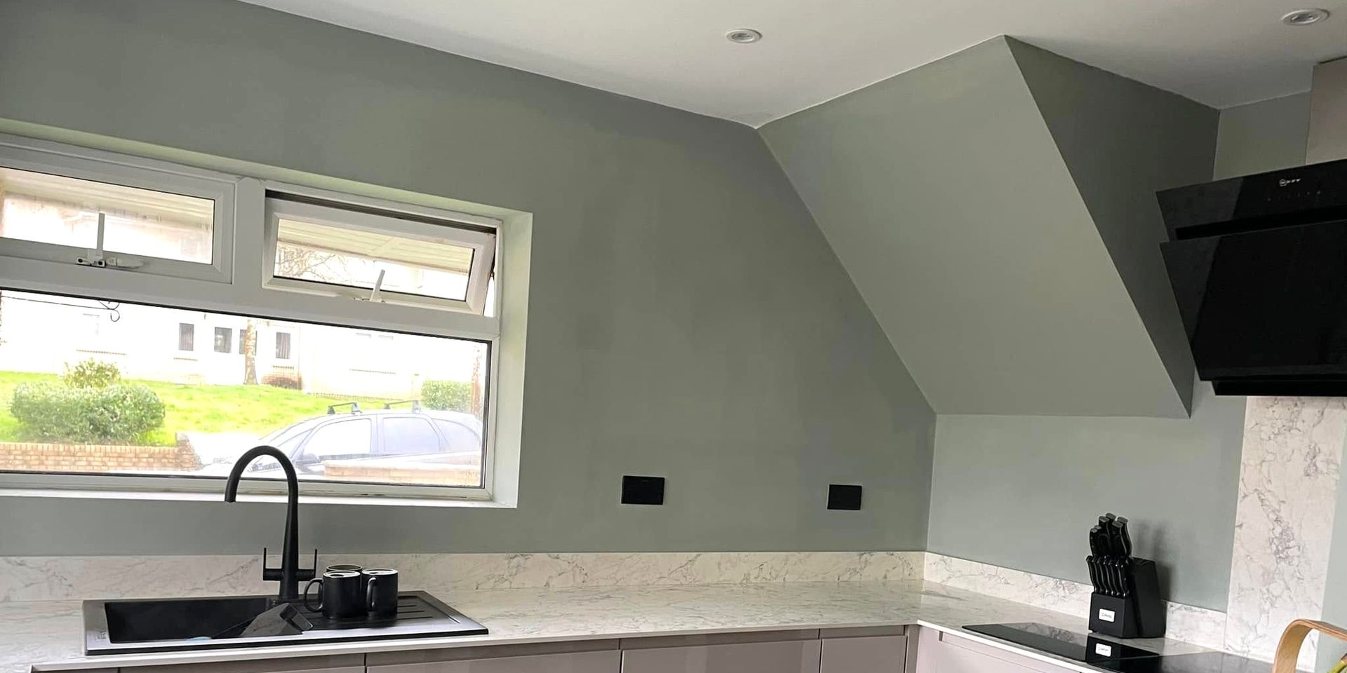 Kitchen interior, walls painted green and ceiling painted in Swansea by Daffodil Decor.