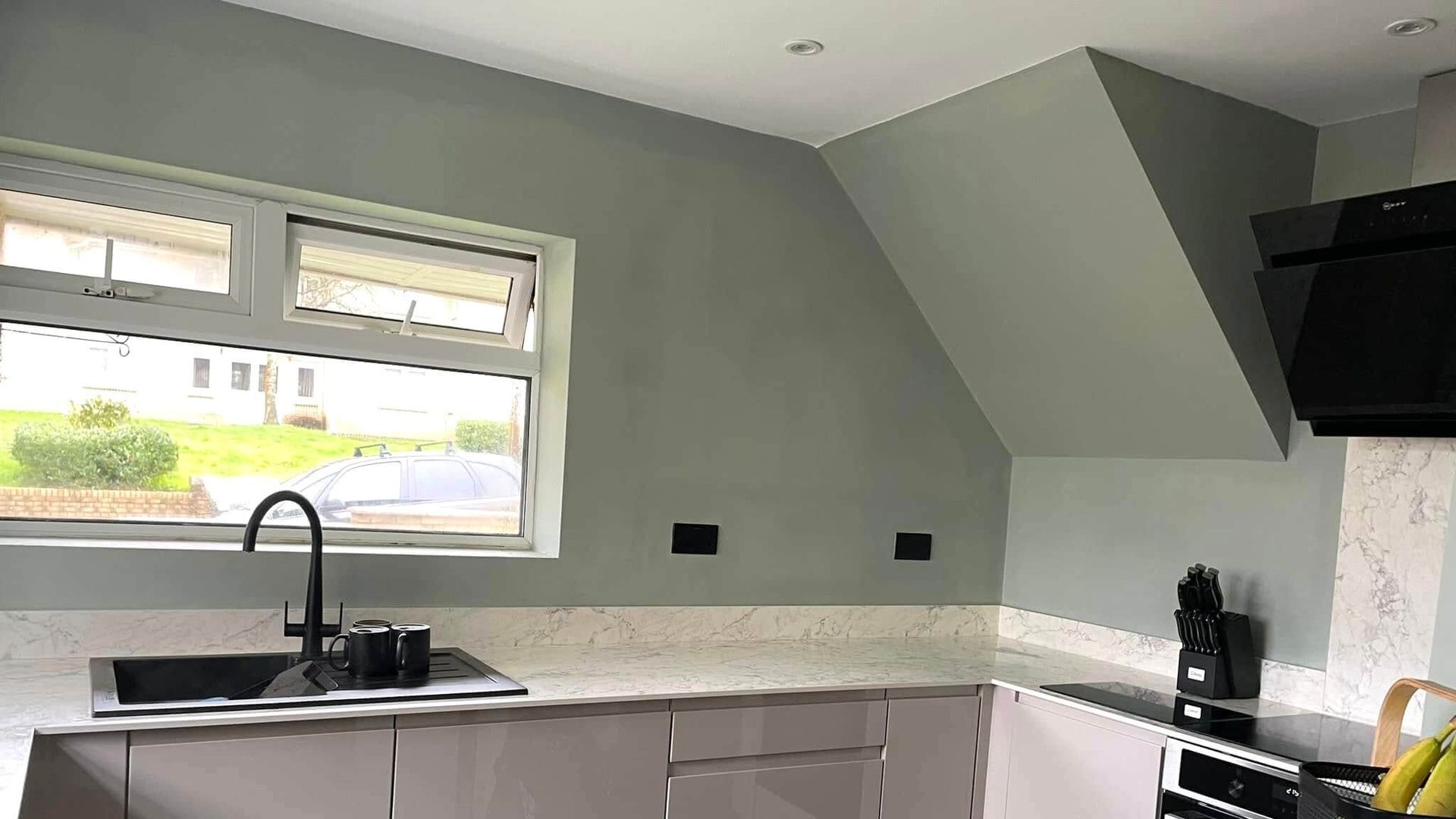 Green painted walls in a newly decorated Mumbles kitchen by Daffodil Decor.