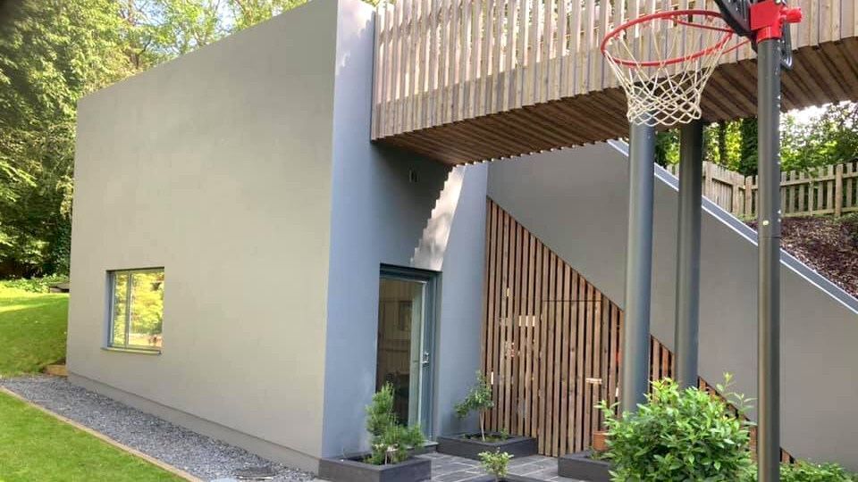 Exterior of Swansea (Mumbles) contemporary house with expertly painted grey walls by Daffodil Decor.