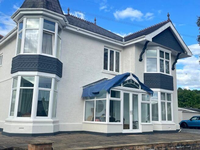 Exterior of Swansea (Mumbles) mansion with expertly painted walls by Daffodil Decor.