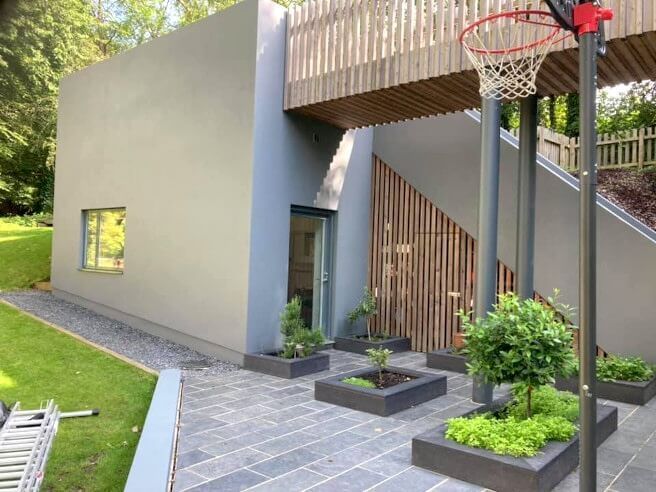 Exterior of Swansea (Mumbles) contemporary house with expertly painted grey walls by Daffodil Decor.