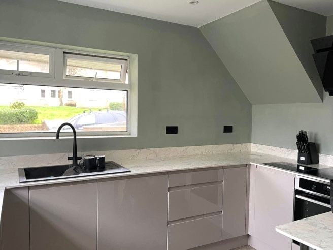 Green painted walls in a newly decorated Mumbles kitchen by Daffodil Decor.