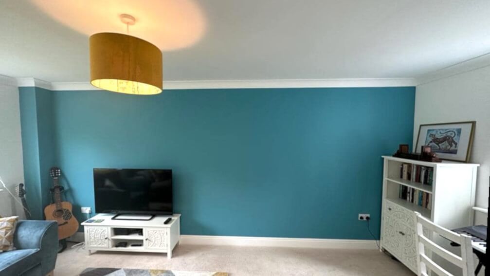 Living room with blue painted walls by Daffodil Decor - a Mumbles home interior.