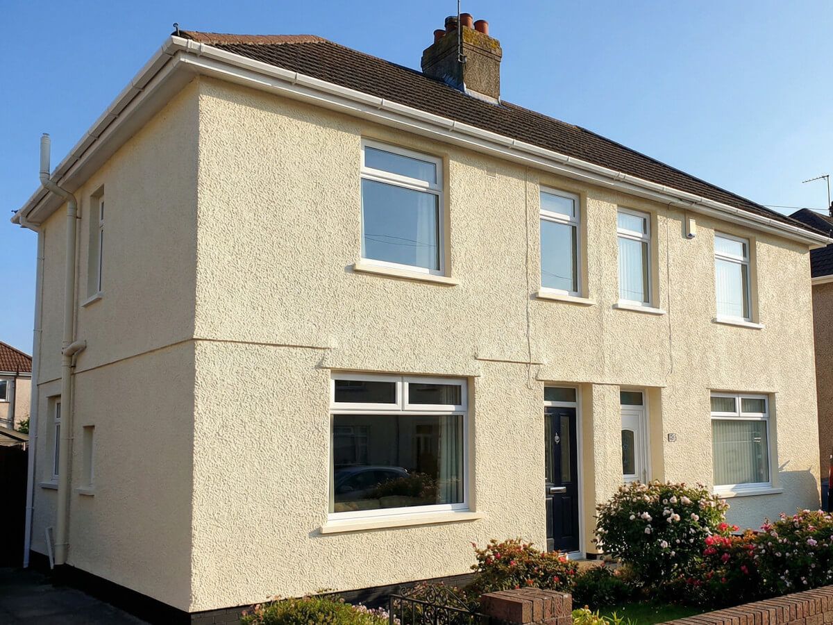 Exterior painted render on Mumbles-style house based on Swansea terraced property by Daffodil Decor.