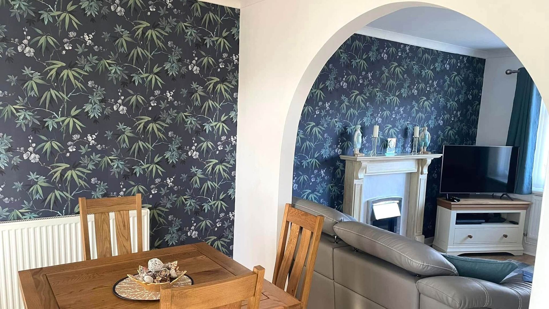 Feature wall wallpaper installation in Mumbles home dining room interior by Daffodil Decor.