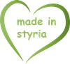 Text „Made in Styria“ in einem grünen herzförmigen Logo.