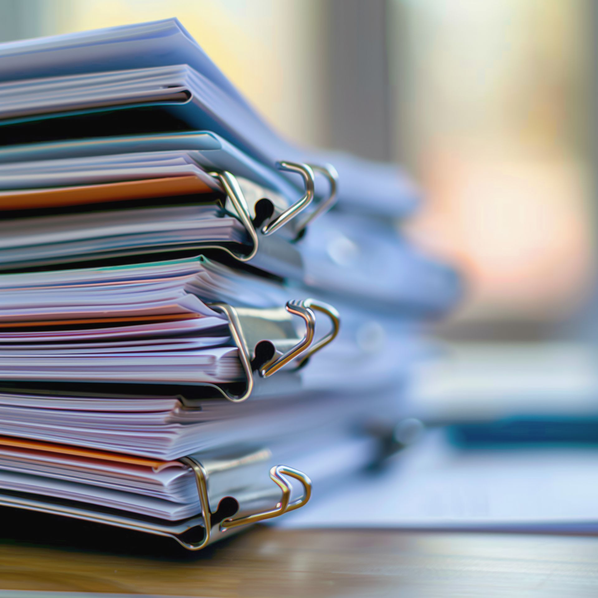 New York City skyline at sunset with orange and yellow sky over buildings.
