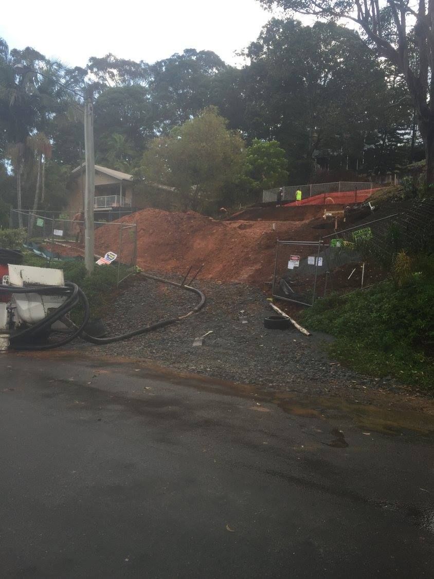 A Large Pile of Dirt is Sitting on the Side of a Road — Tweed Coast Concrete Pumping in Chinderah, NSW