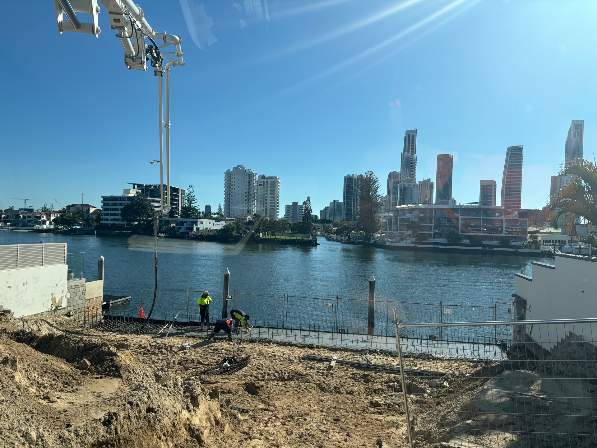 A Tweed Coast Concrete Pumping Truck is Parked on the Side of the Road — Tweed Coast Concrete Pumping in Chinderah, NSW
