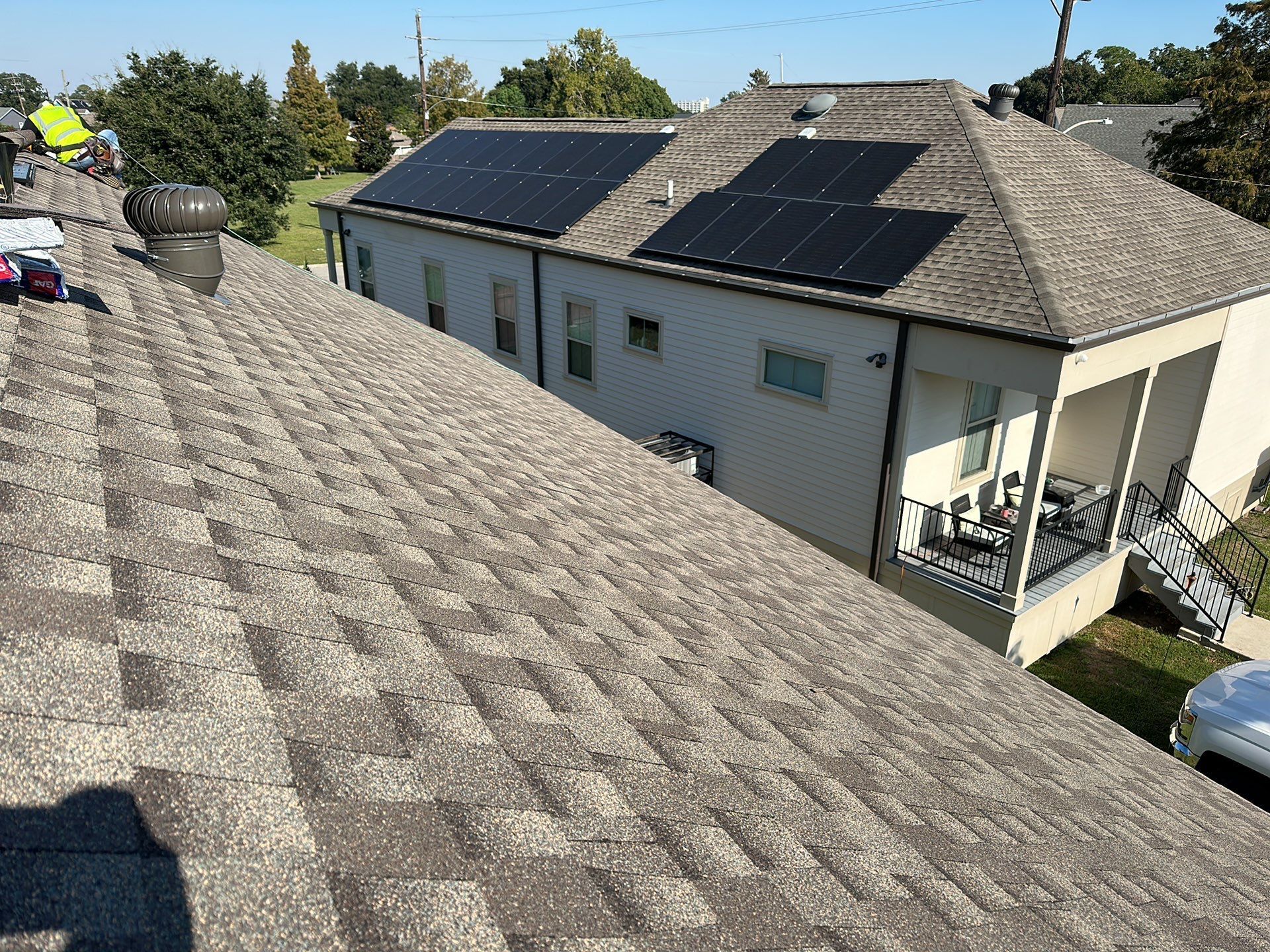 The roof of a house with solar panels on it.