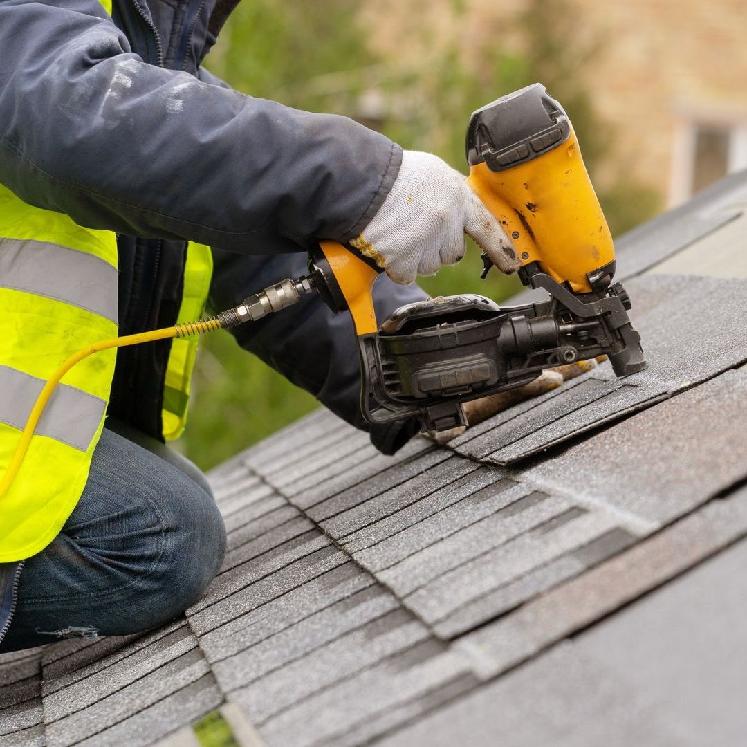 professional roofer during roof installation service