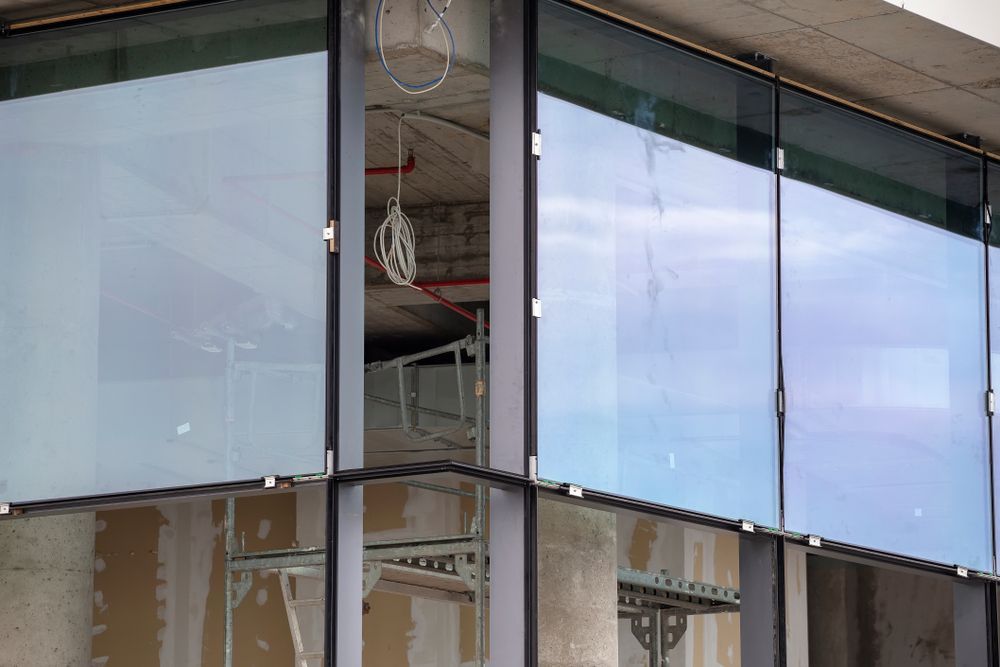Glass Storefront With Reflective Blue Panels — ALUBEST Windows & Doors In Southport, QLD