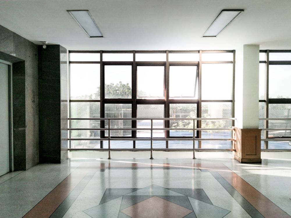 Empty Lobby With Large Windows, Tiled Floor, and a Geometric Floor Pattern — ALUBEST Windows & Doors In Southport, QLD