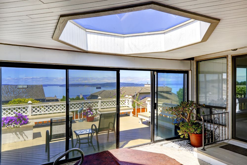 Bright Sunroom With Skylight and Open Glass Doors — ALUBEST Windows & Doors In Southport, QLD