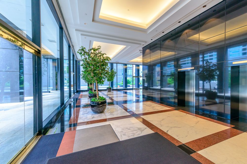 Modern Office Lobby With Glass Walls, and Polished Tile Floor — ALUBEST Windows & Doors In Southport, QLD